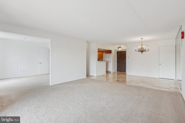 10306 Valley Forge Cir Unit 306, King Of Prussia, PA 19406 - unfurnished living room featuring a chandelier and light carpet