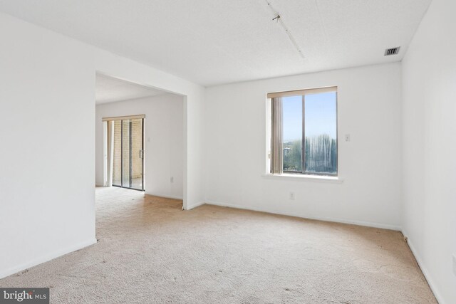 10306 Valley Forge Cir Unit 306, King Of Prussia, PA 19406 - spare room with carpet and baseboards