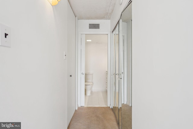 10306 Valley Forge Cir Unit 306, King Of Prussia, PA 19406 - corridor with carpet and tile patterned flooring