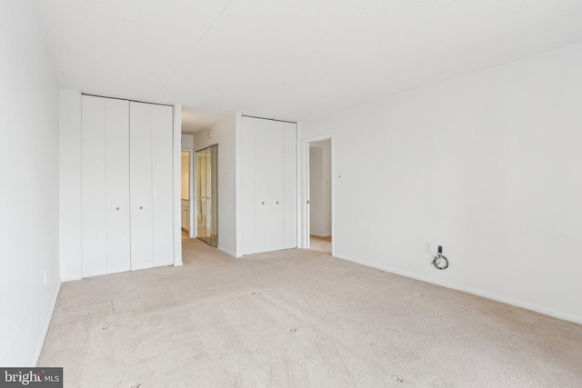 10306 Valley Forge Cir Unit 306, King Of Prussia, PA 19406 - unfurnished bedroom featuring two closets and carpet floors