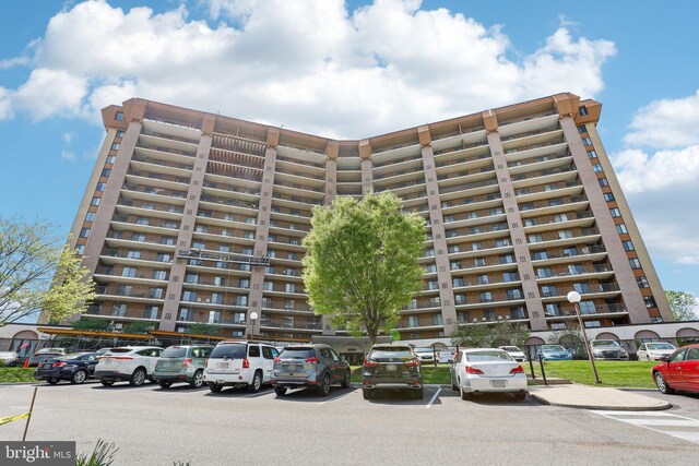 10306 Valley Forge Cir Unit 306, King Of Prussia, PA 19406 - view of apartment building / complex featuring uncovered parking