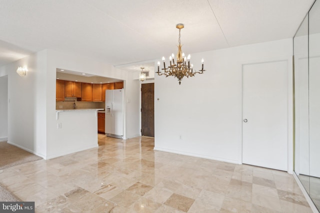 10306 Valley Forge Cir Unit 306, King Of Prussia, PA 19406 - kitchen featuring white fridge with ice dispenser, light countertops, brown cabinetry, a chandelier, and open floor plan