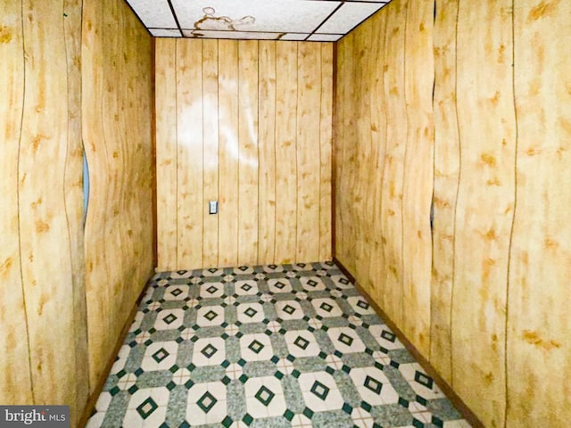 767 Mckean Ave, Donora, PA 15033 - unfurnished room featuring wooden walls and tile patterned floors