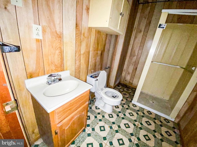 767 Mckean Ave, Donora, PA 15033 - bathroom featuring vanity, wooden walls, and a shower