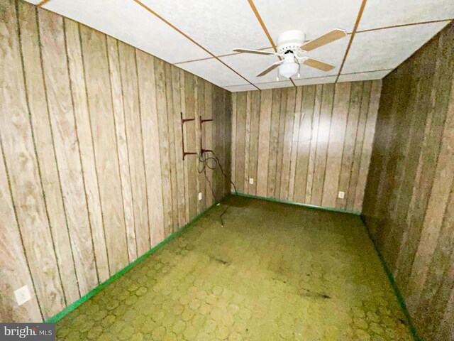767 Mckean Ave, Donora, PA 15033 - unfurnished room with wooden walls and ceiling fan