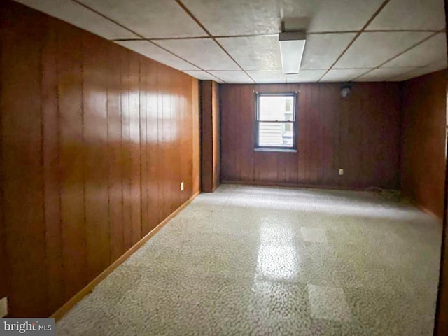 767 Mckean Ave, Donora, PA 15033 - unfurnished room featuring wood walls, a paneled ceiling, and tile patterned floors