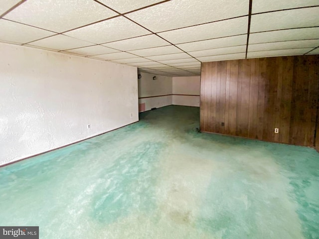 767 Mckean Ave, Donora, PA 15033 - empty room with a drop ceiling, wooden walls, and carpet flooring