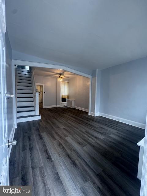 3302 N Palethorp St, Philadelphia, PA 19140 - unfurnished living room with stairs, dark wood-style flooring, and ceiling fan