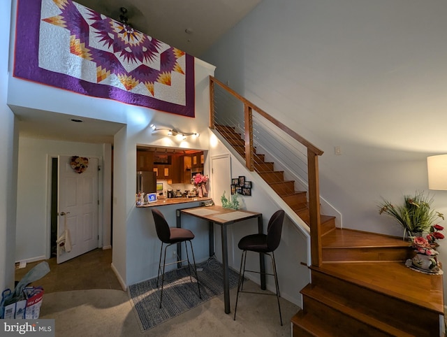 1720 Lake Shore Crest Dr Unit 34, Reston, VA 20190 - stairs featuring carpet floors and a towering ceiling