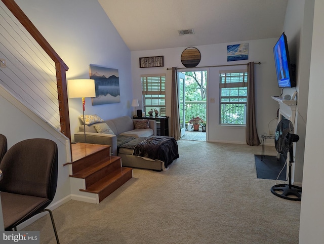 1720 Lake Shore Crest Dr Unit 34, Reston, VA 20190 - carpeted living area with stairs, vaulted ceiling, and a fireplace
