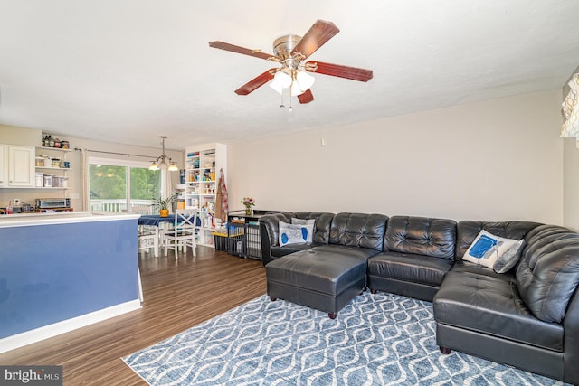 463 Maple St, Manchester, PA 17345 - living room with wood finished floors, a ceiling fan, and a chandelier