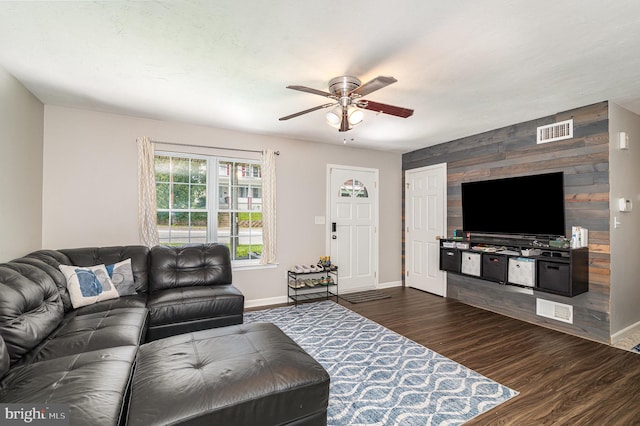 463 Maple St, Manchester, PA 17345 - living room with ceiling fan, dark wood finished floors, and an accent wall
