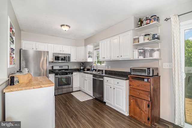 463 Maple St, Manchester, PA 17345 - kitchen with appliances with stainless steel finishes, dark wood-type flooring, healthy amount of natural light, and white cabinets
