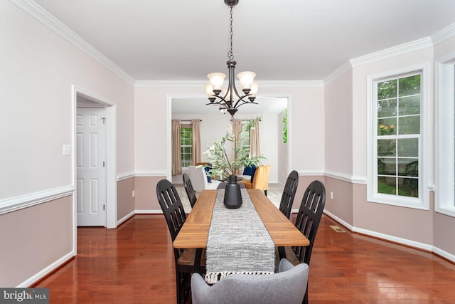 173 Empress Alexandra Pl, Fredericksburg, VA 22406 - dining area featuring a chandelier, healthy amount of natural light, wood finished floors, and ornamental molding