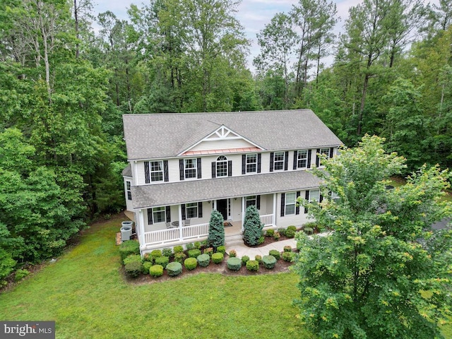 173 Empress Alexandra Pl, Fredericksburg, VA 22406 - colonial home with covered porch, roof with shingles, and a front yard