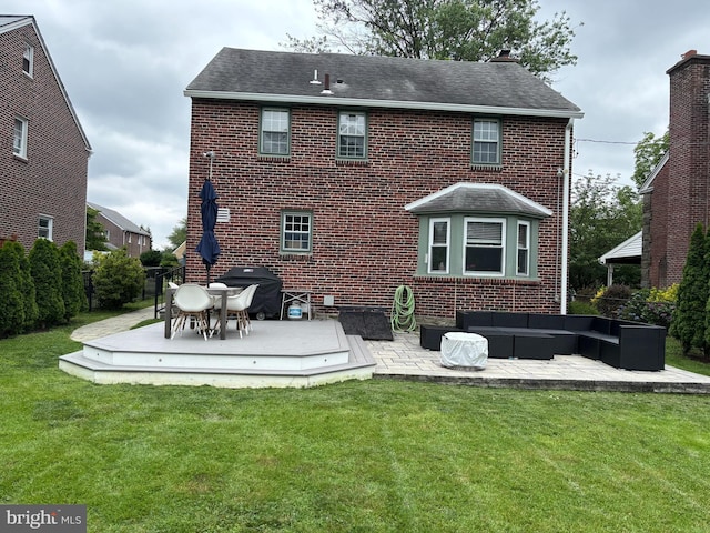10 Braeburn Rd, Havertown, PA 19083 - back of property featuring an outdoor hangout area, brick siding, a shingled roof, and a patio area