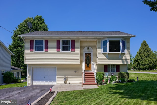 1 Sherman St, Hanover, PA 17331 - bi-level home featuring driveway, a front yard, and a garage