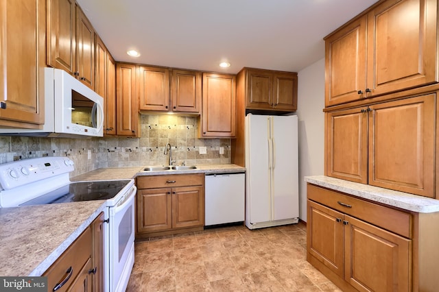 1 Sherman St, Hanover, PA 17331 - kitchen with white appliances, brown cabinets, backsplash, and recessed lighting