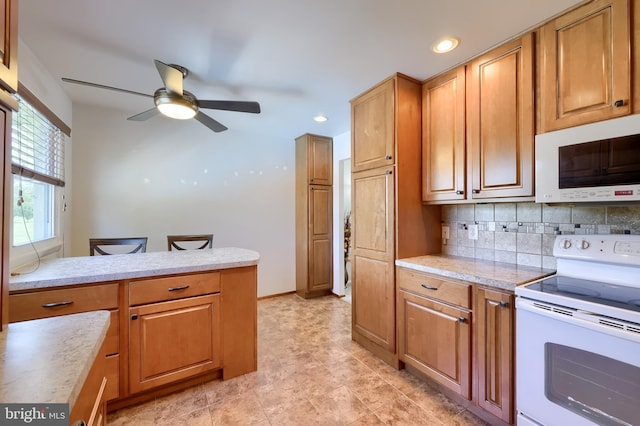 1 Sherman St, Hanover, PA 17331 - kitchen with white appliances, light countertops, a ceiling fan, decorative backsplash, and recessed lighting