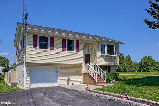 1 Sherman St, Hanover, PA 17331 - raised ranch featuring asphalt driveway, a front yard, and a garage