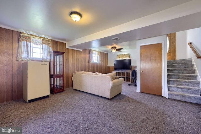 1 Sherman St, Hanover, PA 17331 - living room featuring carpet floors, wood walls, stairs, and a ceiling fan