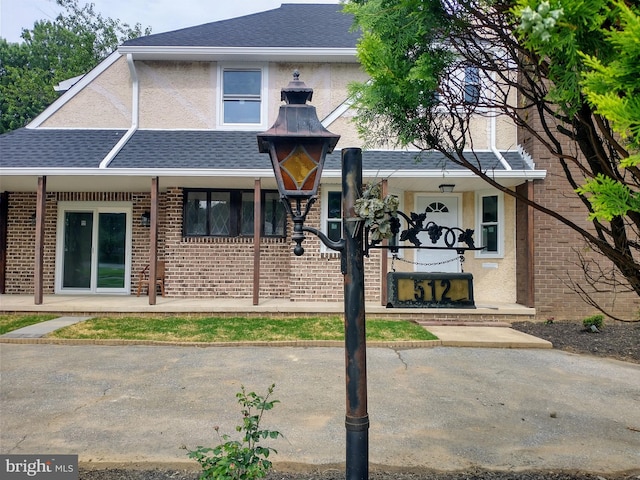 512 Mifflin Blvd, Reading, PA 19607 - view of front facade featuring brick siding and roof with shingles
