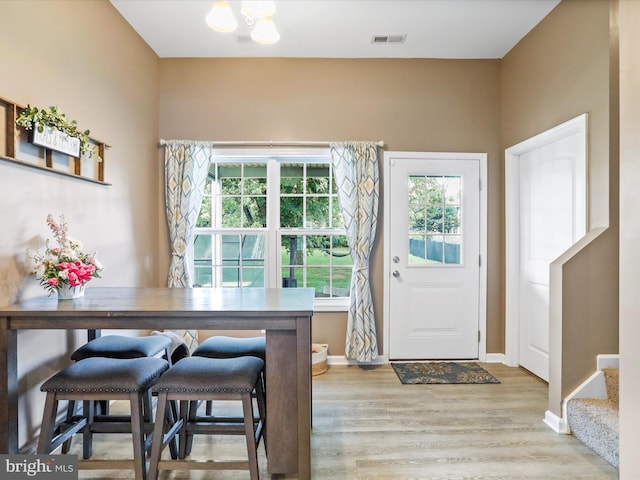 309 Legion St, Martinsburg, WV 25404 - dining space featuring wood finished floors and a chandelier