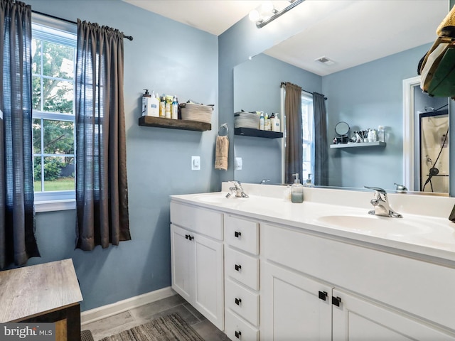 309 Legion St, Martinsburg, WV 25404 - bathroom featuring double vanity and tile patterned flooring