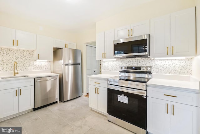 804 Gregorio Dr, Silver Spring, MD 20901 - kitchen featuring appliances with stainless steel finishes, light countertops, tasteful backsplash, and white cabinets