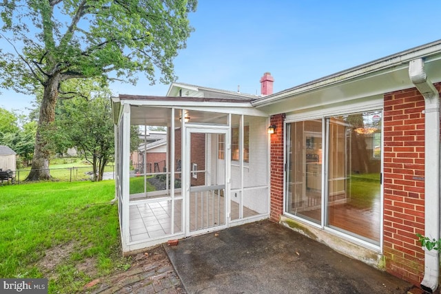 804 Gregorio Dr, Silver Spring, MD 20901 - exterior space with a sunroom, brick siding, and a chimney