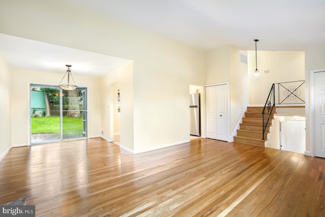 804 Gregorio Dr, Silver Spring, MD 20901 - unfurnished living room featuring light wood-style flooring and stairway