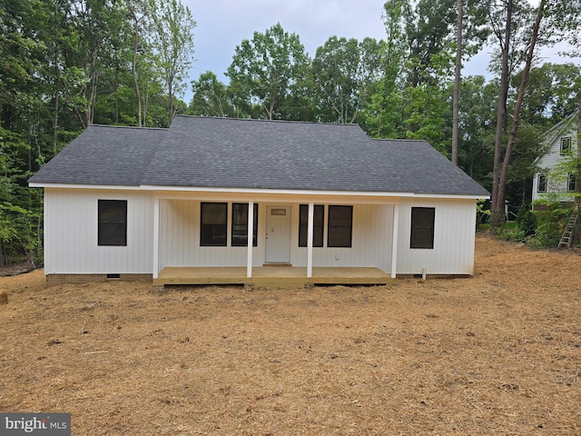 728 Meadow Dr, Tappahannock, VA 22560 - view of front of property featuring roof with shingles, crawl space, covered porch, and view of scattered trees
