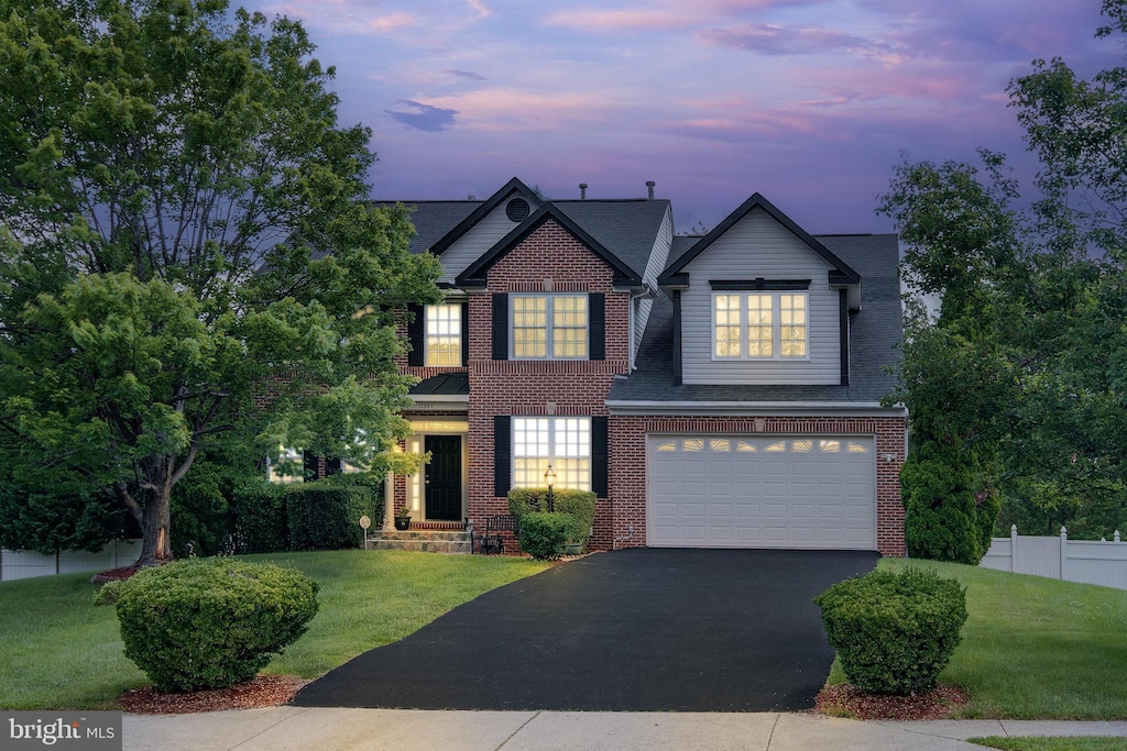 12967 Queen Chapel Rd, Woodbridge, VA 22193 - view of front of house featuring a garage, driveway, brick siding, and a shingled roof