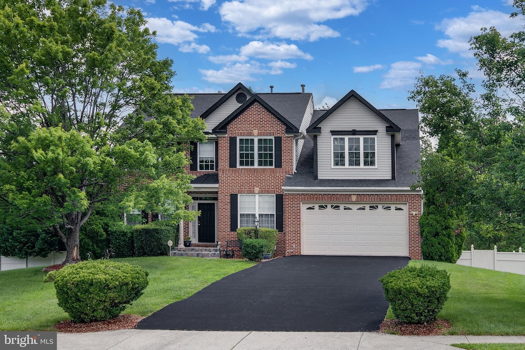 12967 Queen Chapel Rd, Woodbridge, VA 22193 - view of front of house featuring asphalt driveway, an attached garage, brick siding, and a shingled roof