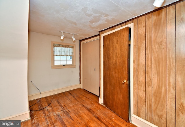 2228 Hillthorpe Ave, Abington, PA 19001 - unfurnished bedroom featuring hardwood / wood-style floors, two closets, and track lighting