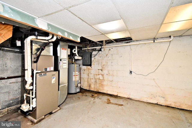 2228 Hillthorpe Ave, Abington, PA 19001 - unfinished below grade area featuring gas water heater, electric panel, heating unit, and a drop ceiling
