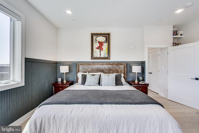 1532 N Capitol NW Unit 402, Washington, DC 20002 - bedroom with light wood finished floors and wainscoting
