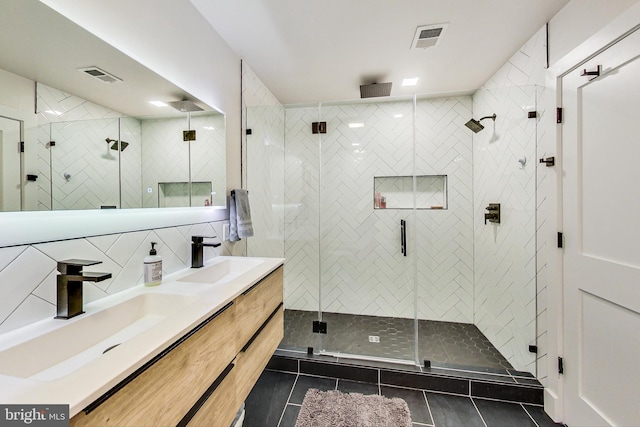1532 N Capitol NW Unit 402, Washington, DC 20002 - full bathroom with tile patterned floors, double vanity, a shower stall, and backsplash