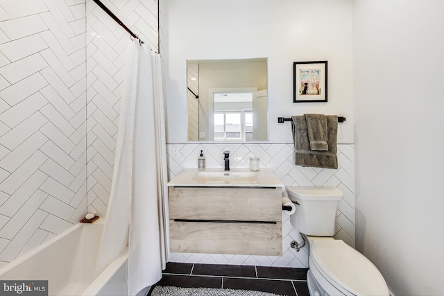1532 N Capitol NW Unit 402, Washington, DC 20002 - bathroom featuring tile walls, vanity, shower / tub combo with curtain, and wainscoting