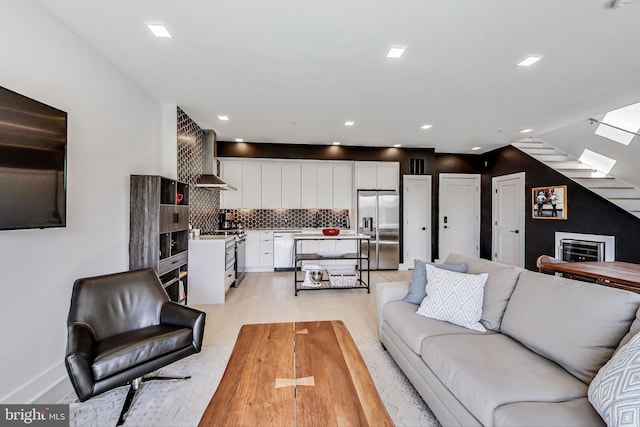 1532 N Capitol NW Unit 402, Washington, DC 20002 - living area featuring light wood-style floors, stairway, and recessed lighting