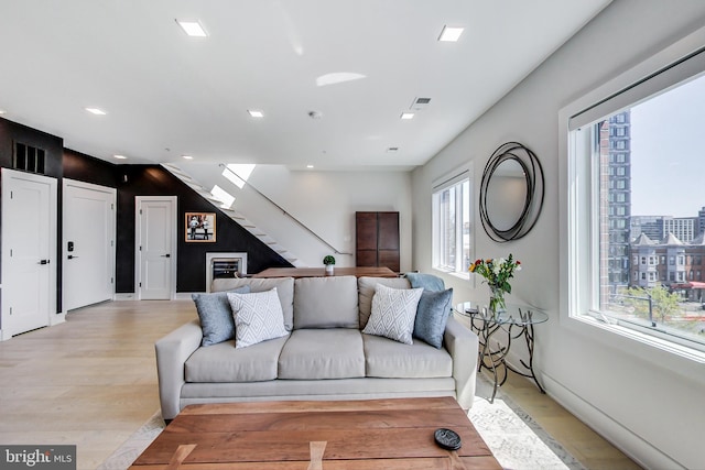 1532 N Capitol NW Unit 402, Washington, DC 20002 - living area featuring light wood-type flooring, stairs, and recessed lighting