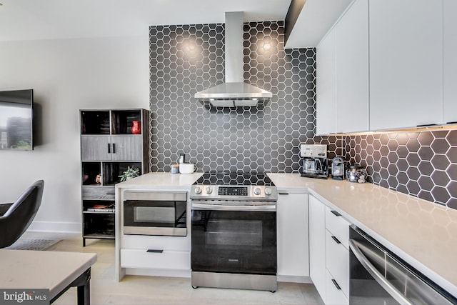 1532 N Capitol NW Unit 402, Washington, DC 20002 - kitchen with stainless steel appliances, wall chimney range hood, backsplash, and light countertops