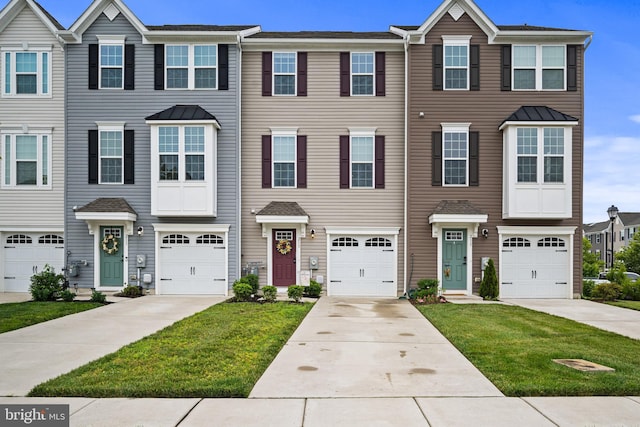 213 Dalton, Woolwich Twp, NJ 08085 - townhome / multi-family property with a front lawn, driveway, and an attached garage
