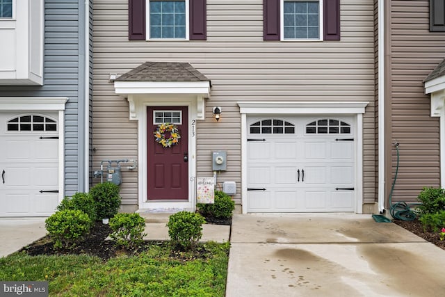 213 Dalton, Woolwich Twp, NJ 08085 - doorway to property featuring driveway and a garage
