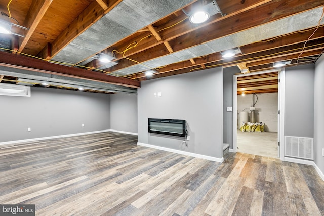 310 E Charlotte St, Millersville, PA 17551 - finished basement featuring heating unit and wood finished floors