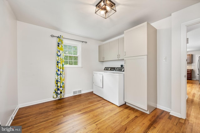 310 E Charlotte St, Millersville, PA 17551 - laundry area featuring washer and dryer, cabinet space, and light wood-style flooring