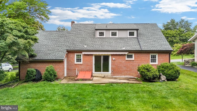 310 E Charlotte St, Millersville, PA 17551 - back of property with a patio area, a lawn, and roof with shingles
