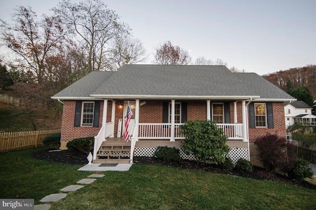 110 Jamestown Rd, Front Royal, VA 22630 - view of front facade featuring a porch, brick siding, and roof with shingles