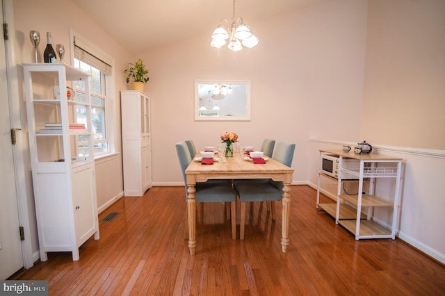 110 Jamestown Rd, Front Royal, VA 22630 - dining room featuring a chandelier, light wood-style flooring, and lofted ceiling