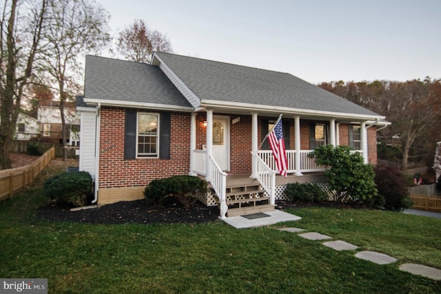 110 Jamestown Rd, Front Royal, VA 22630 - view of front of property with brick siding, a porch, and roof with shingles
